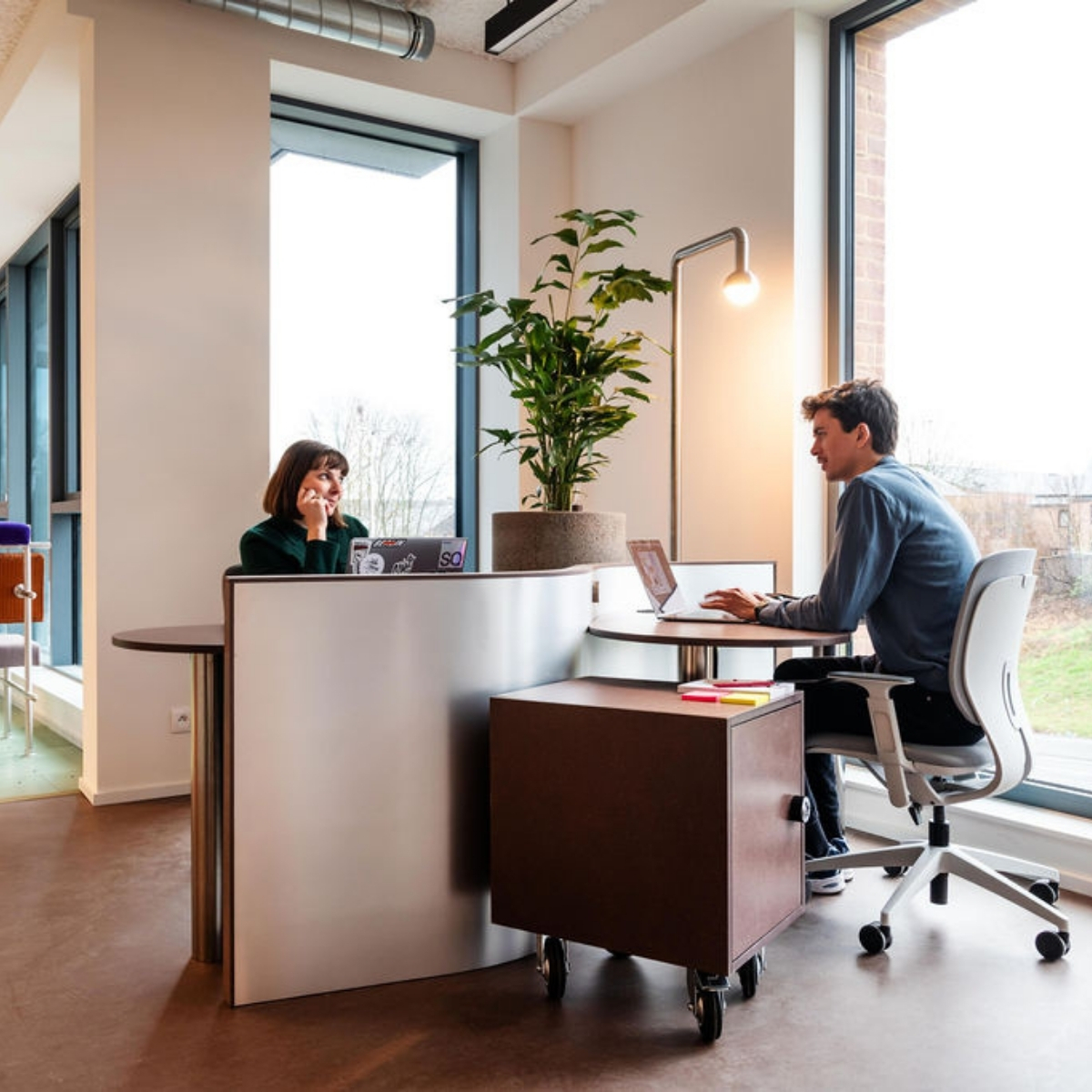 Dedicated desk at silversquare louvain la neuve with two people working